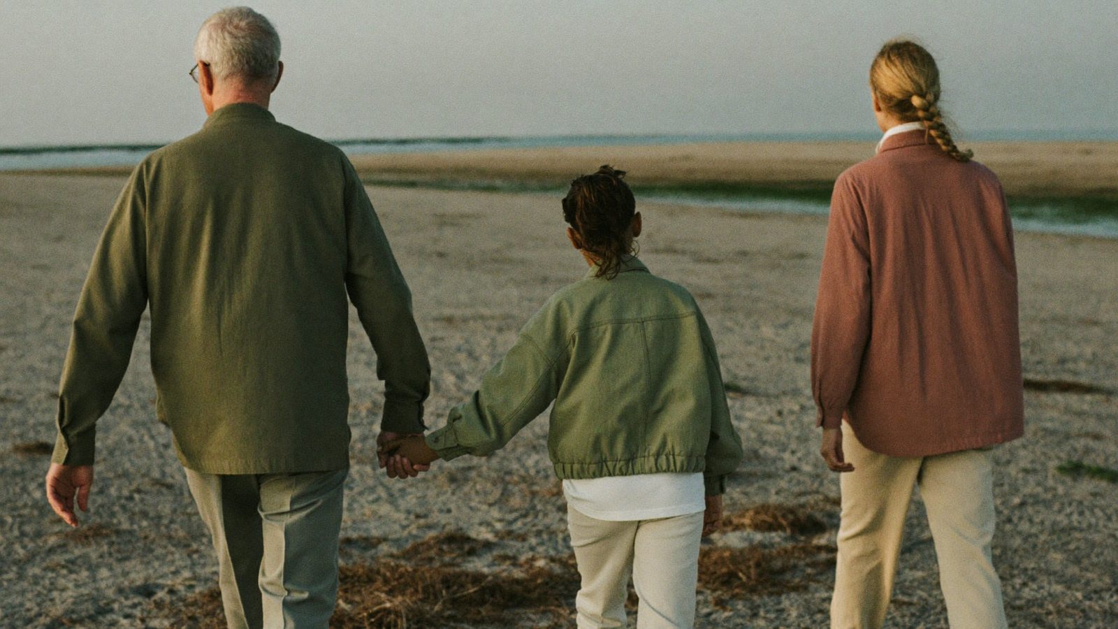 Three generations of a family walking together